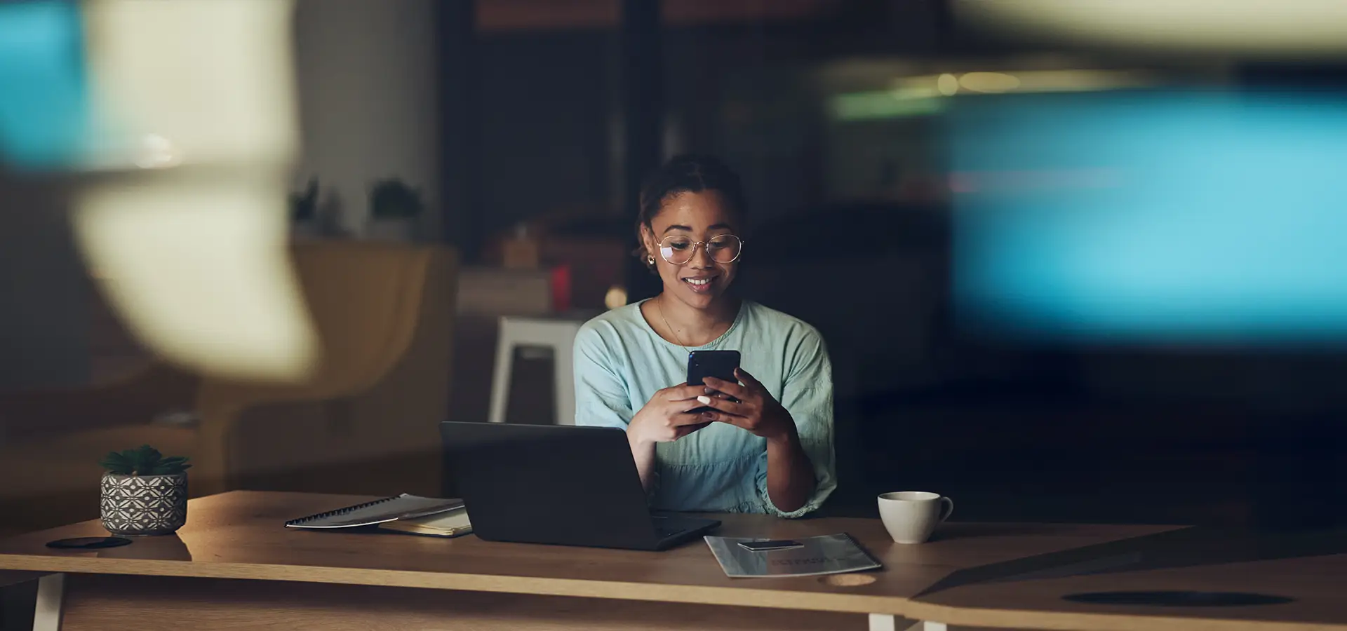 Image of a smart woman entrepreneur looking at her mobile