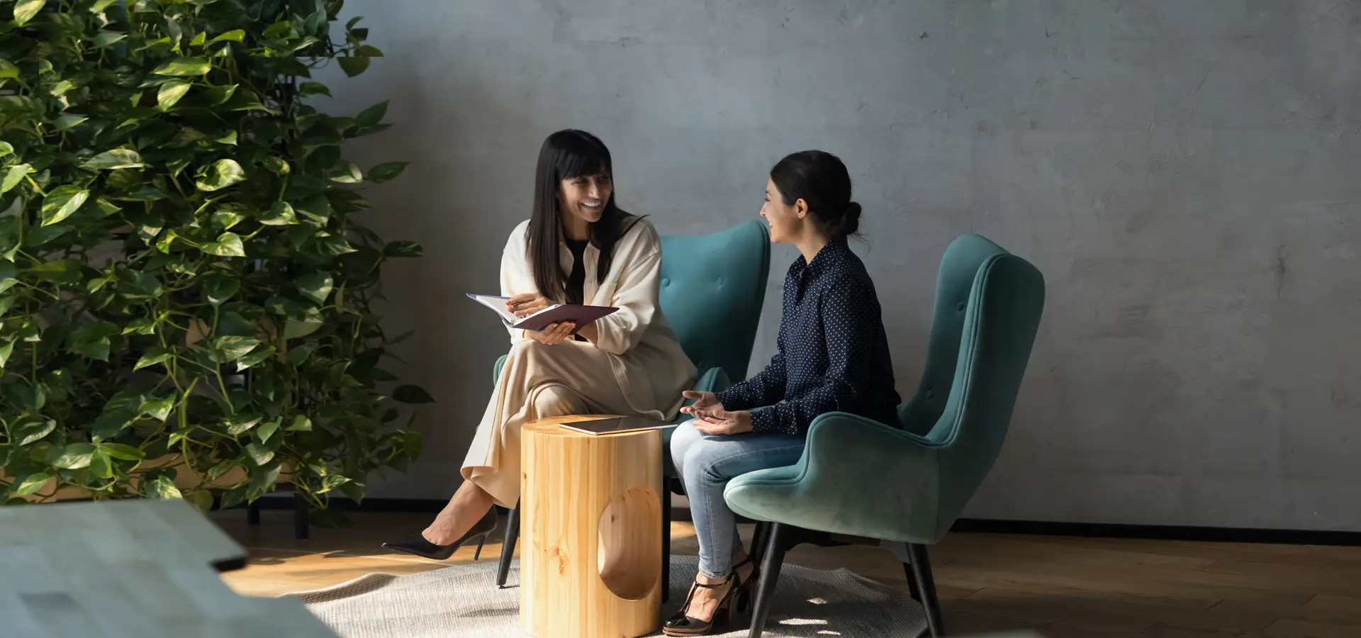 Two female executives in an informal meeting