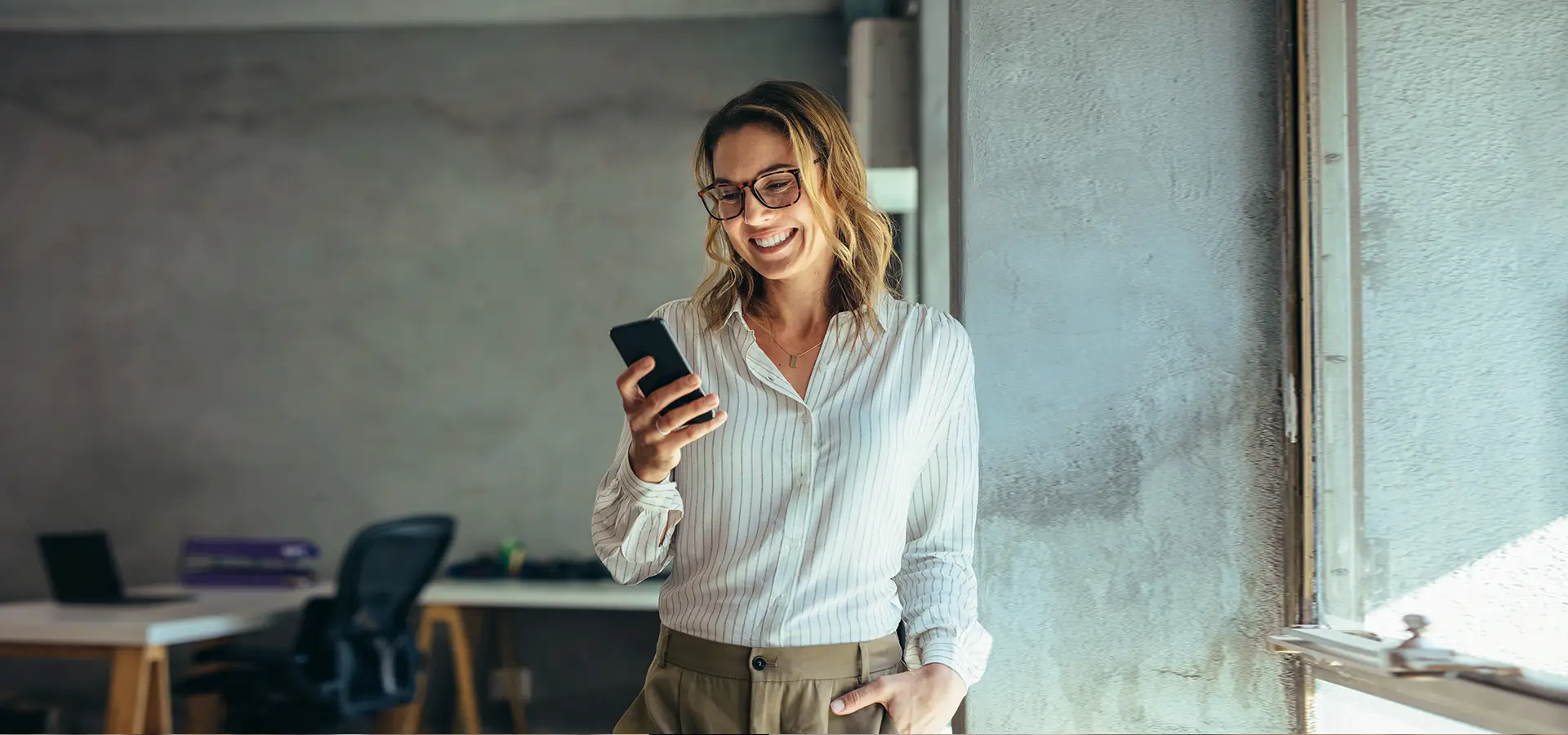 Female executive looking at mobile